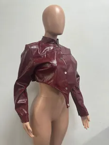 Detail of burgundy cropped faux leather jacket with asymmetrical pointed hem