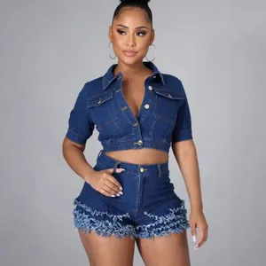 Women's two-piece denim set featuring a cropped jacket and frayed fringe shorts.