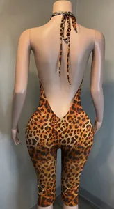 Detailed back view of a leopard print halter neck backless slim jumpsuit on mannequin