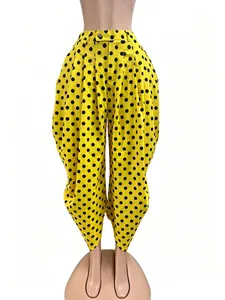 Yellow polka dot harem pants displayed on a full-body mannequin torso.
