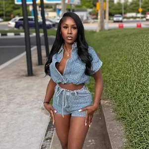 Full body detail of trendy summer denim two-piece set featuring cropped vest and shorts