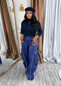 Detail view of stylish blue faux leather cargo pants with zippers and multi-pockets