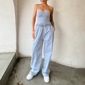 Close-up of light blue denim two-piece set with strapless tube top and wide-leg pants