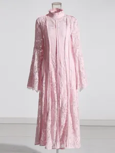 Elegant pink lace maxi dress featuring a chic ruffled stand collar and bell sleeves.