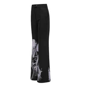 Side view of black high-waisted wide-leg trousers with white floral print design