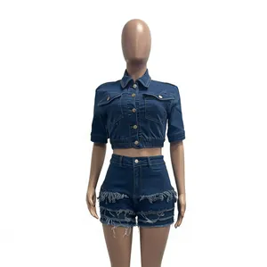 Detailed view of women's slim fit denim two-piece set with frayed edges and tassels