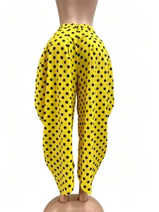 Vibrant yellow wide-leg balloon pants featuring black polka dots and cropped fit