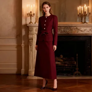 Full view of elegant burgundy French vintage suit in a classic interior setting