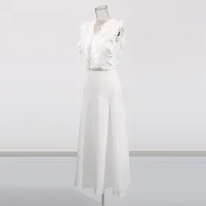 Detail view of white French retro lace embroidery set with delicate hollow patterns.