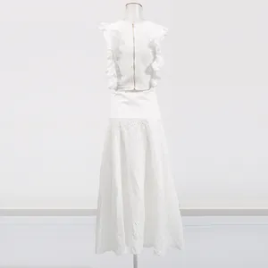 Detail of white French vintage lace hollow embroidery set with flutter sleeve top