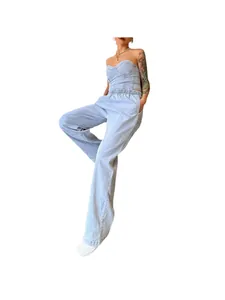 Full body view of light blue denim two-piece set featuring corset top and wide-leg pants.
