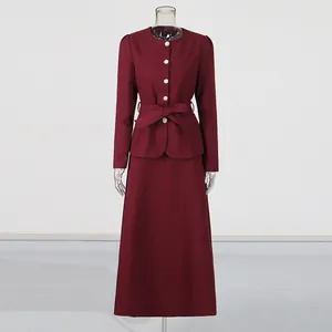 Elegant burgundy two-piece set featuring a bow-tie jacket and a high-waist maxi skirt
