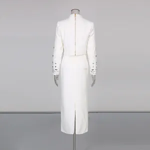 Rear view of elegant white two-piece skirt set with intricate beaded sleeve detailing