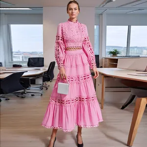 Detail of pink eyelet lace two-piece maxi skirt set with elegant hollow out embroidery