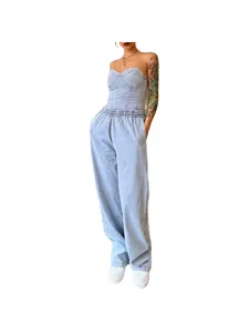 Detail view of stylish light blue strapless denim top and loose wide-leg pants set