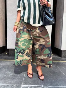 Street style view of women's camouflage wide-leg pants with a relaxed fit and cotton texture