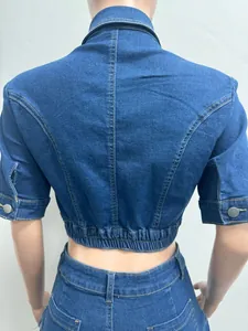 Detailed back view of a slim fit blue denim crop top jacket with elastic waist detail