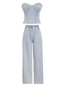 Close-up of a two-piece light wash stretch denim set with corset top and wide-leg pants