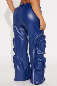Detail of blue faux leather cargo pants with multiple pockets and side zippers