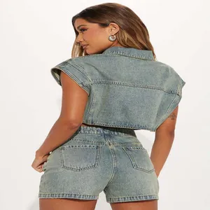 Back view of a chic women's two-piece denim outfit featuring a cropped vest and shorts
