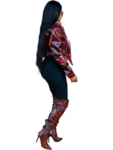 Side profile view showing a burgundy glossy cropped faux leather jacket for women