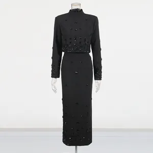 Full view of black two-piece set with elegant beaded and rhinestone details