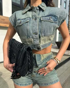 Trendy two-piece denim set with cropped patchwork vest and matching high-waist shorts