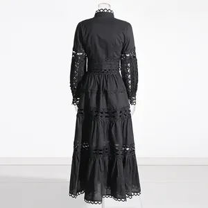 Back view of a black French vintage two-piece set featuring intricate hollow-out lace details.