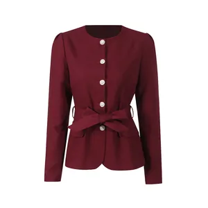 Close-up of a elegant burgundy French vintage jacket with pearl buttons and bow belt