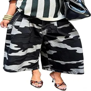 Detailed view of the wide-leg cut and bold camouflage pattern on women's culottes pants