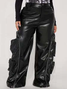Detail of black faux leather cargo pants with decorative zippers and multiple pockets