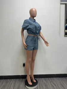 Side view of a textured blue summer two-piece outfit with crop shirt and shorts