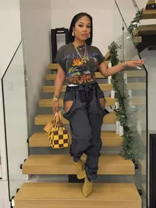 Chic women's irregular cut-out denim pants with zipper detail in streetwear style
