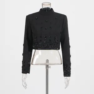 Detail view of elegant black beaded rhinestone long sleeve crop top for women's high-end set