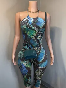 Floral print halter neck backless slim fit jumpsuit with tropical palm leaf pattern