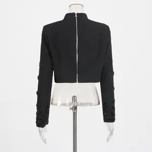 Elegant black crop top featuring a back zipper and intricate black beadwork on sleeves