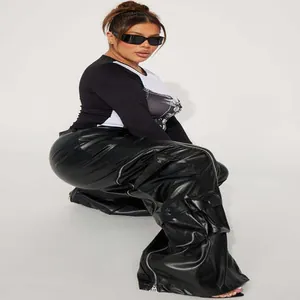 Stylish black faux leather cargo pants with detachable zipper details and multiple pockets