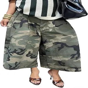Detailed view of women's camouflage wide-leg pants styled with leopard print heels