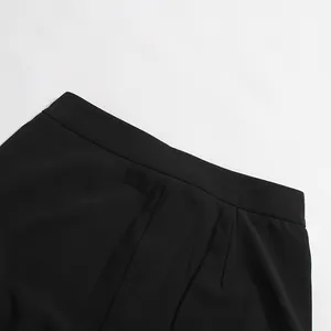 Detailed macro shot of high-quality black suit trousers waistband and fabric texture