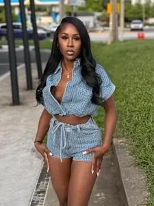 Chic summer casual denim two-piece set featuring cropped shirt and drawstring shorts