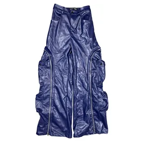 Navy blue faux leather cargo pants featuring decorative zippers and multi-pocket design