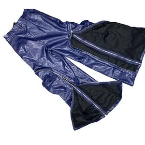 Detailed view of fashionable blue leather trousers featuring multiple zippers and wide-leg design