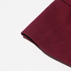 Macro view of the high-quality wine red twill fabric detail from a French vintage set.