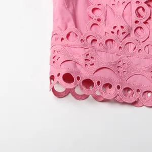 Close-up detail of exquisite pink lace hollow embroidery on French retro style skirt set