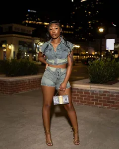 Stylish women's two-piece denim set featuring a cropped vest top and matching shorts
