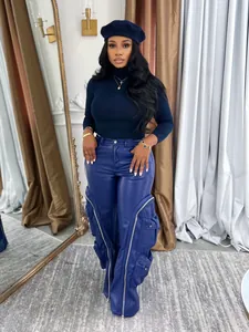 Chic blue wide-leg faux leather pants featuring cargo pockets and zipper details