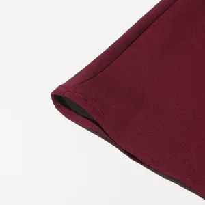 Close-up showing the fine stitching and fabric texture of a burgundy vintage style suit