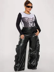 Fashionable faux leather cargo pants with zippers and multiple pockets on model