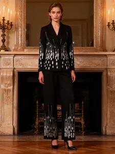 Elegant black two-piece suit set featuring silver sequin patterns and straight-leg trousers