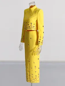 Elegant two-piece yellow suit with rhinestones, cropped top and high waist long skirt